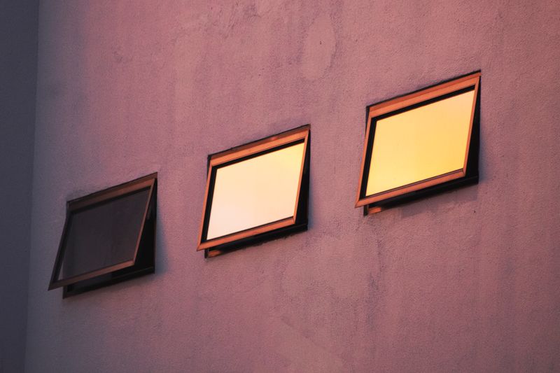 Awning windows propped open from the bottom